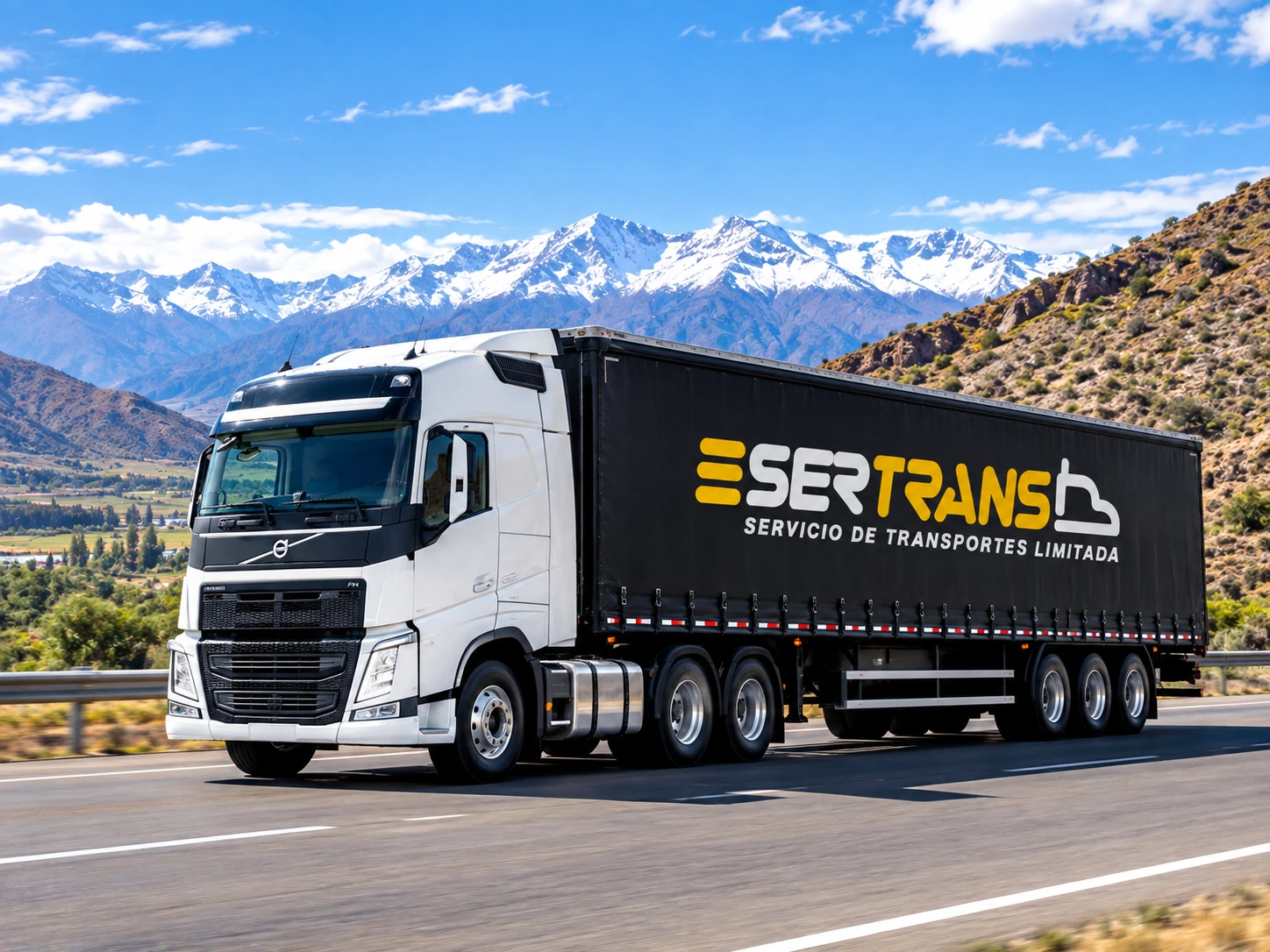 Camión SerTrans en ruta con la cordillera al fondo